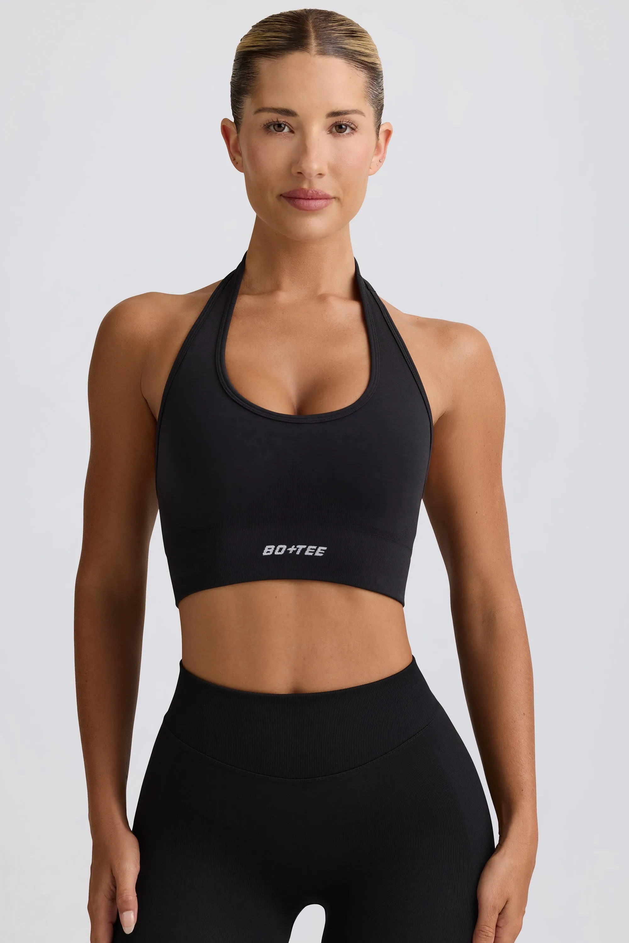 Define Luxe Halterneck Sports Bra in Black sold by Oh Polly