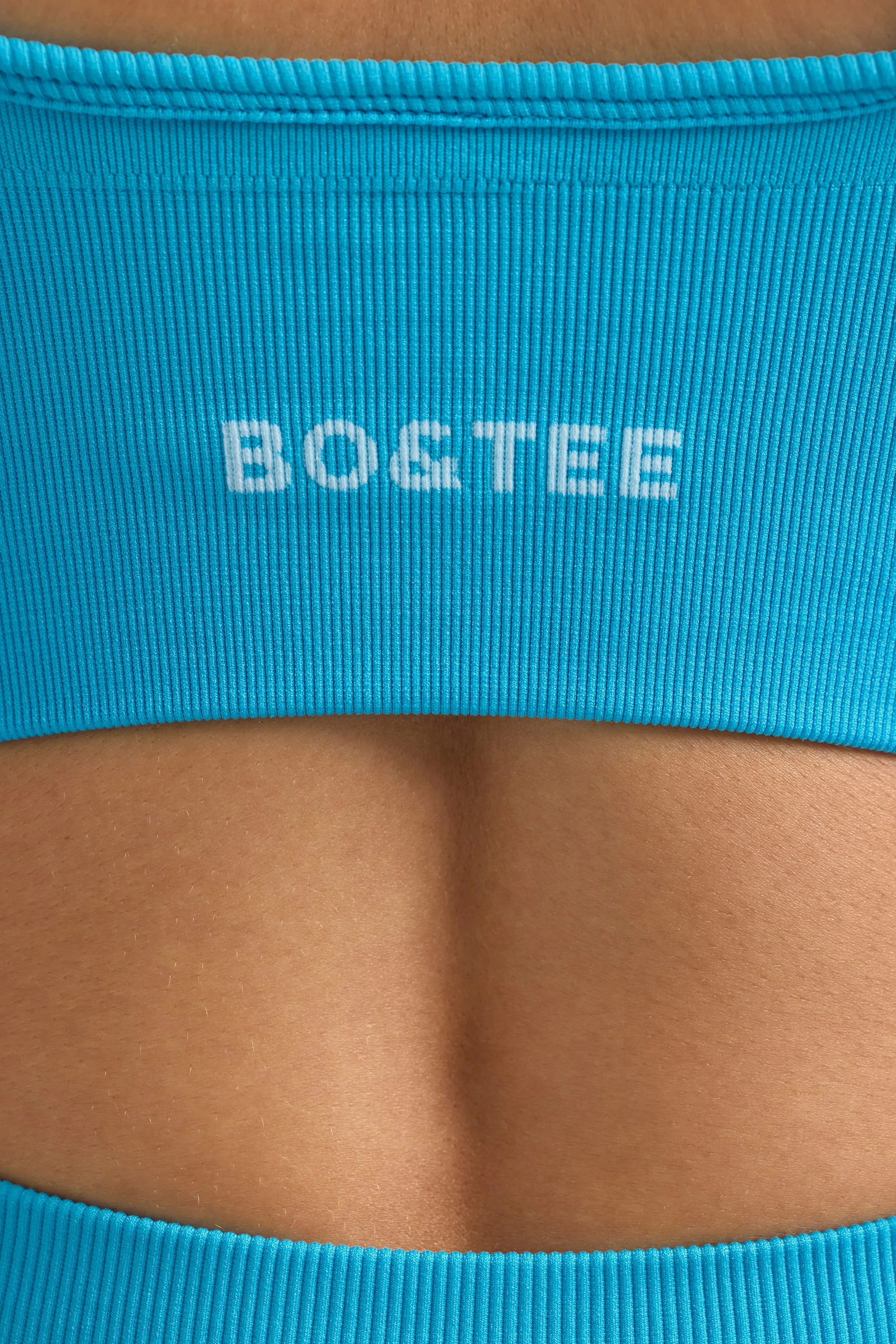 Define Luxe V-Neck Sports Bra in Turquoise Blue sold by Oh Polly product image thumbnail 4