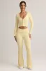 Modal Ribbed Foldover Flared Trousers in Buttercream Yellow sold by Oh Polly