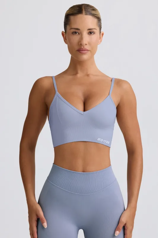 Define Luxe V-Neck Sports Bra in Blue Grey sold by Oh Polly