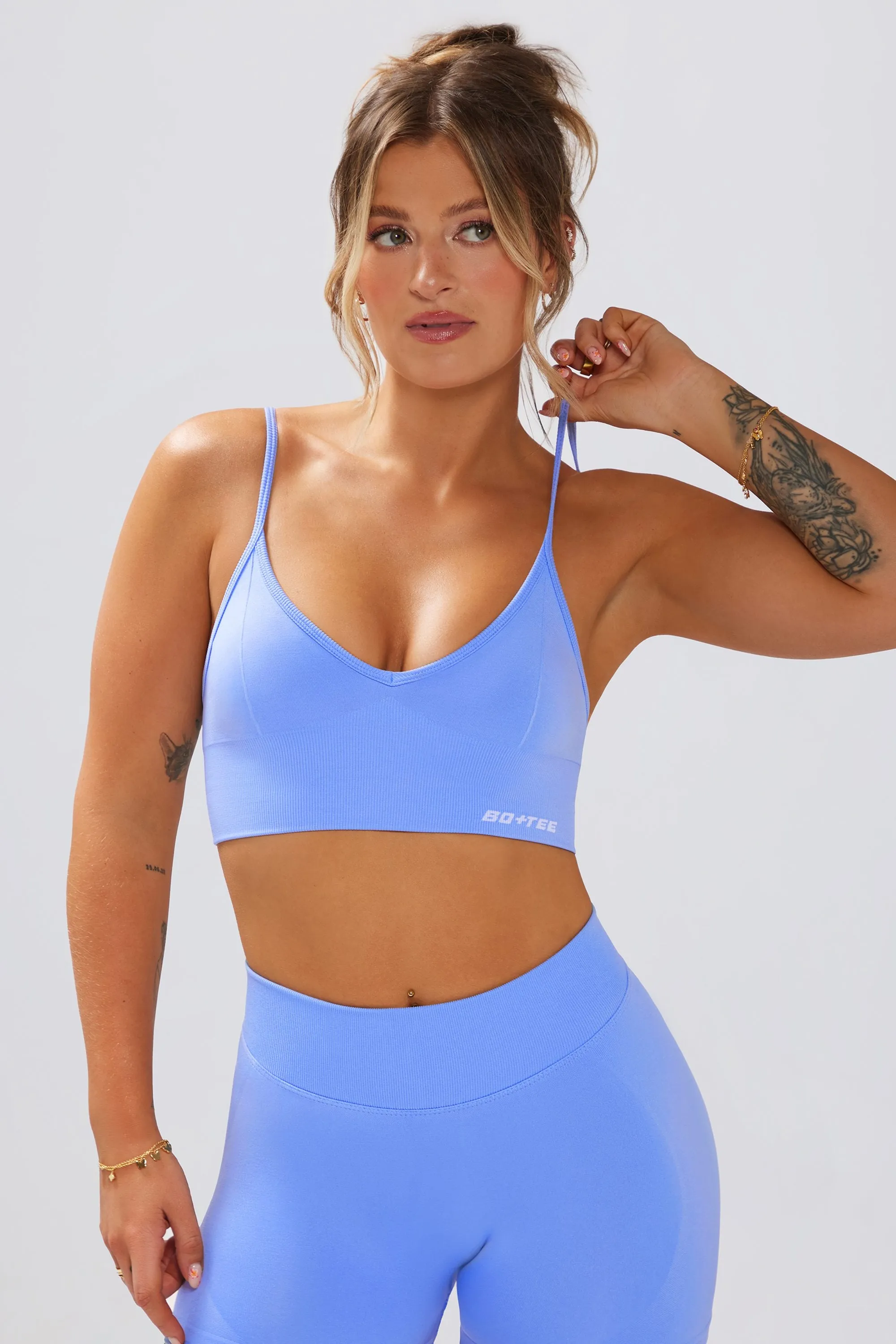Define Luxe V-Neck Sports Bra in Light Blue sold by Oh Polly