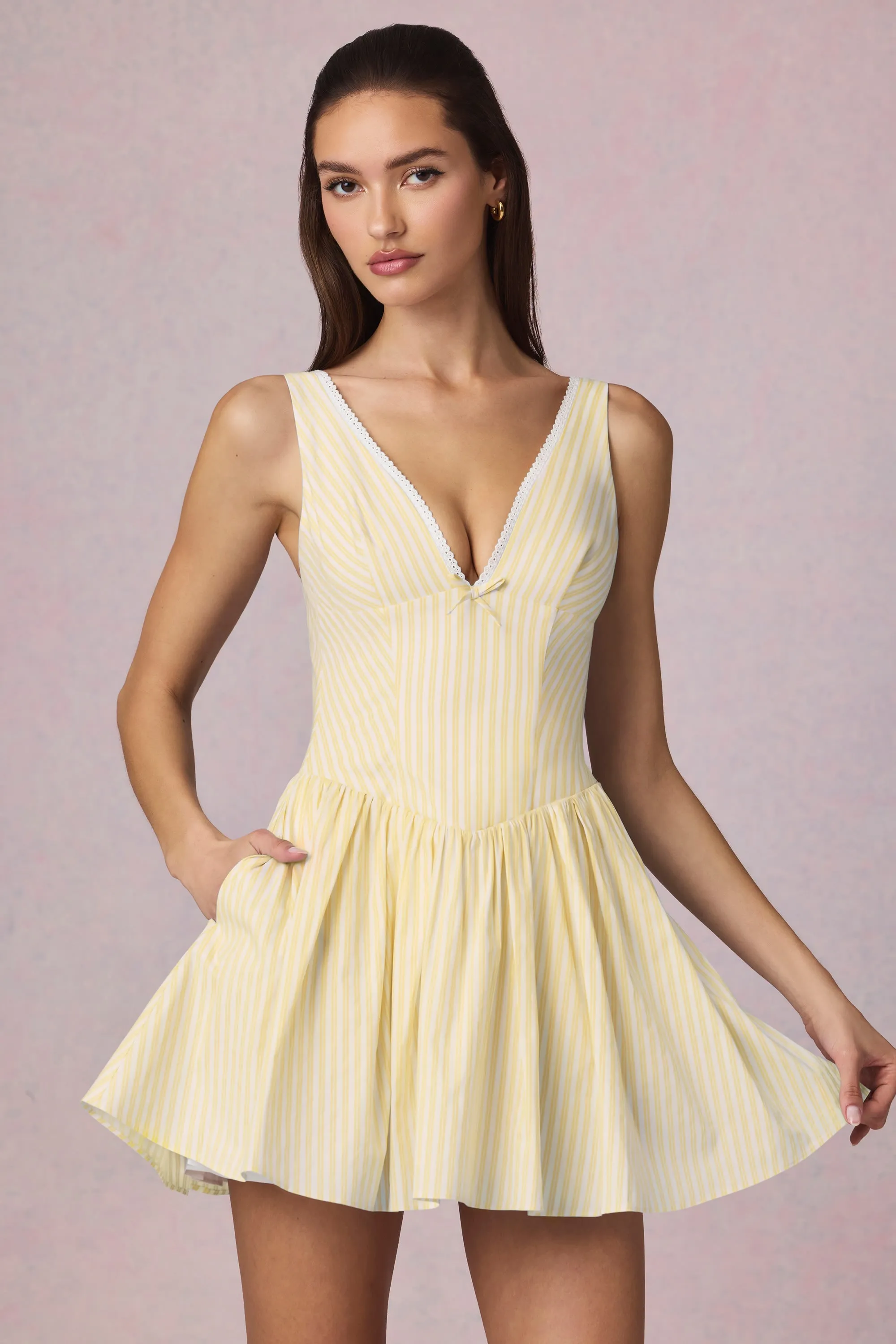 Bow-Detail A-Line Mini Dress in Lemon Yellow Stripe sold by Oh Polly