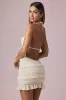 Ruffled Backless Halterneck Mini Dress in Ivory sold by Oh Polly