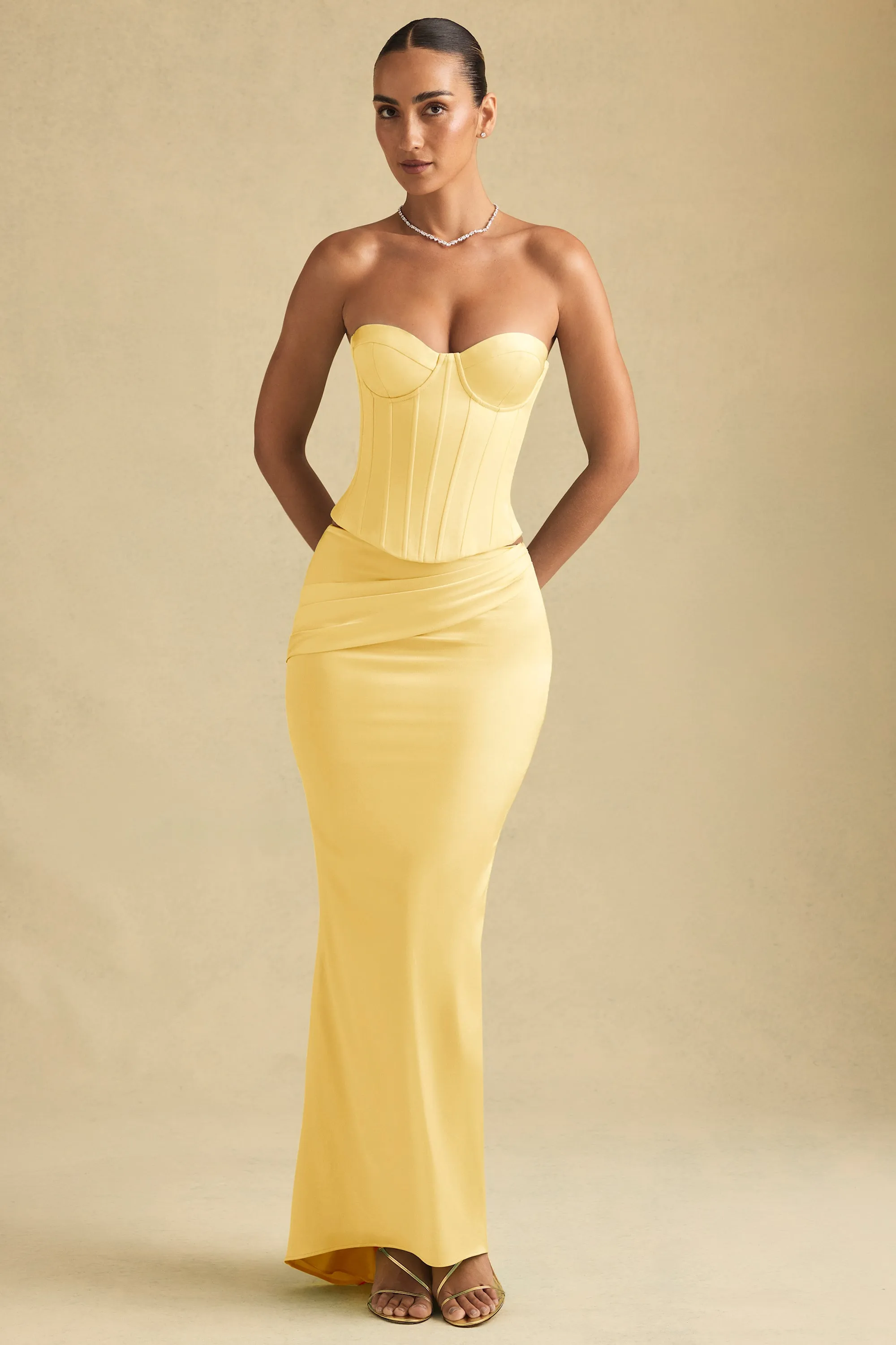 Draped Low-Rise Maxi Skirt in Pastel Yellow sold by Oh Polly