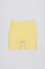 Soft Active Crossover Pocket Shorts in Lemon sold by Oh Polly