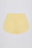Button-Detail Mid-Rise Shorts in Lemon sold by Oh Polly