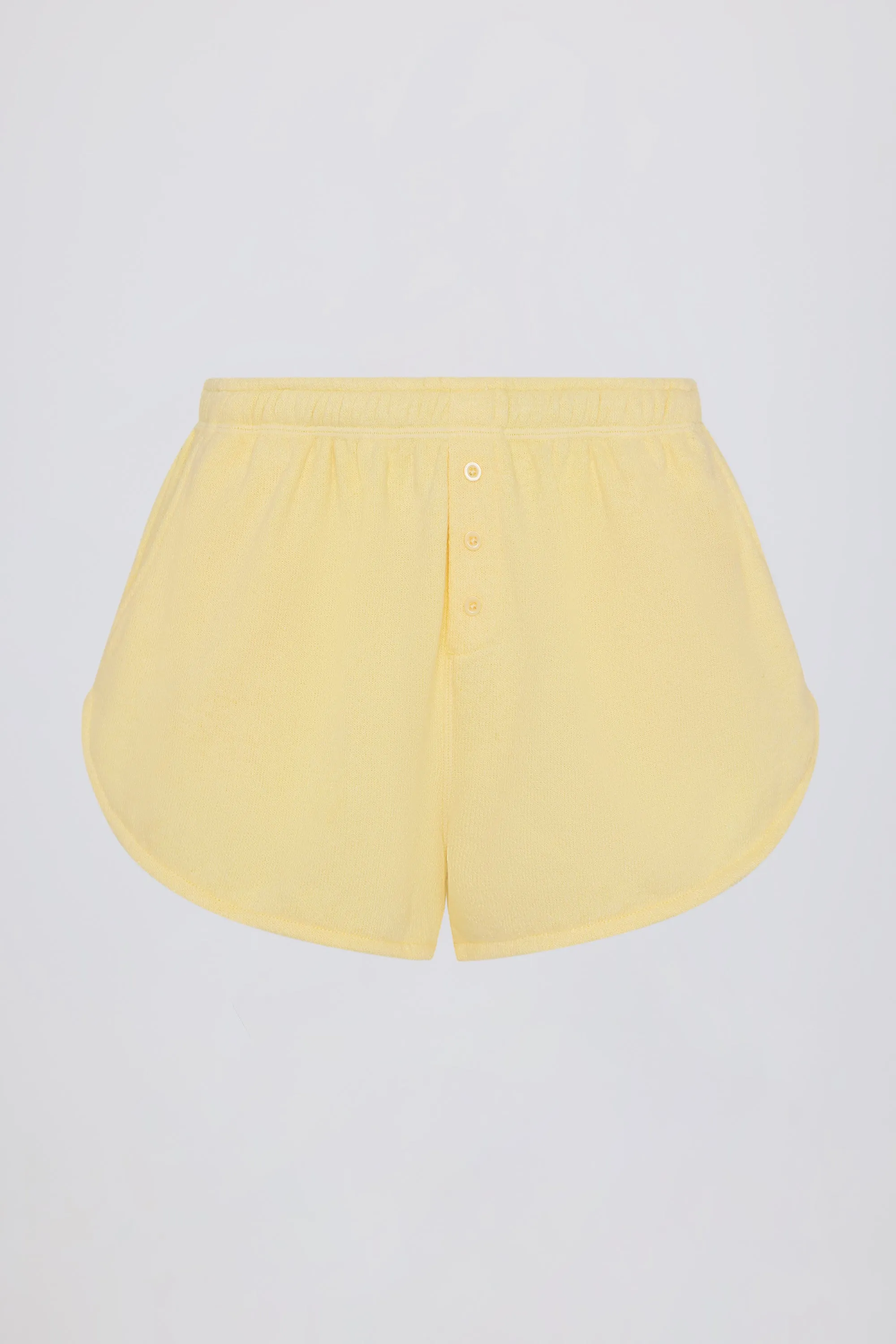 Button-Detail Mid-Rise Shorts in Lemon sold by Oh Polly product image thumbnail 4