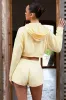 Button-Detail Mid-Rise Shorts in Lemon sold by Oh Polly