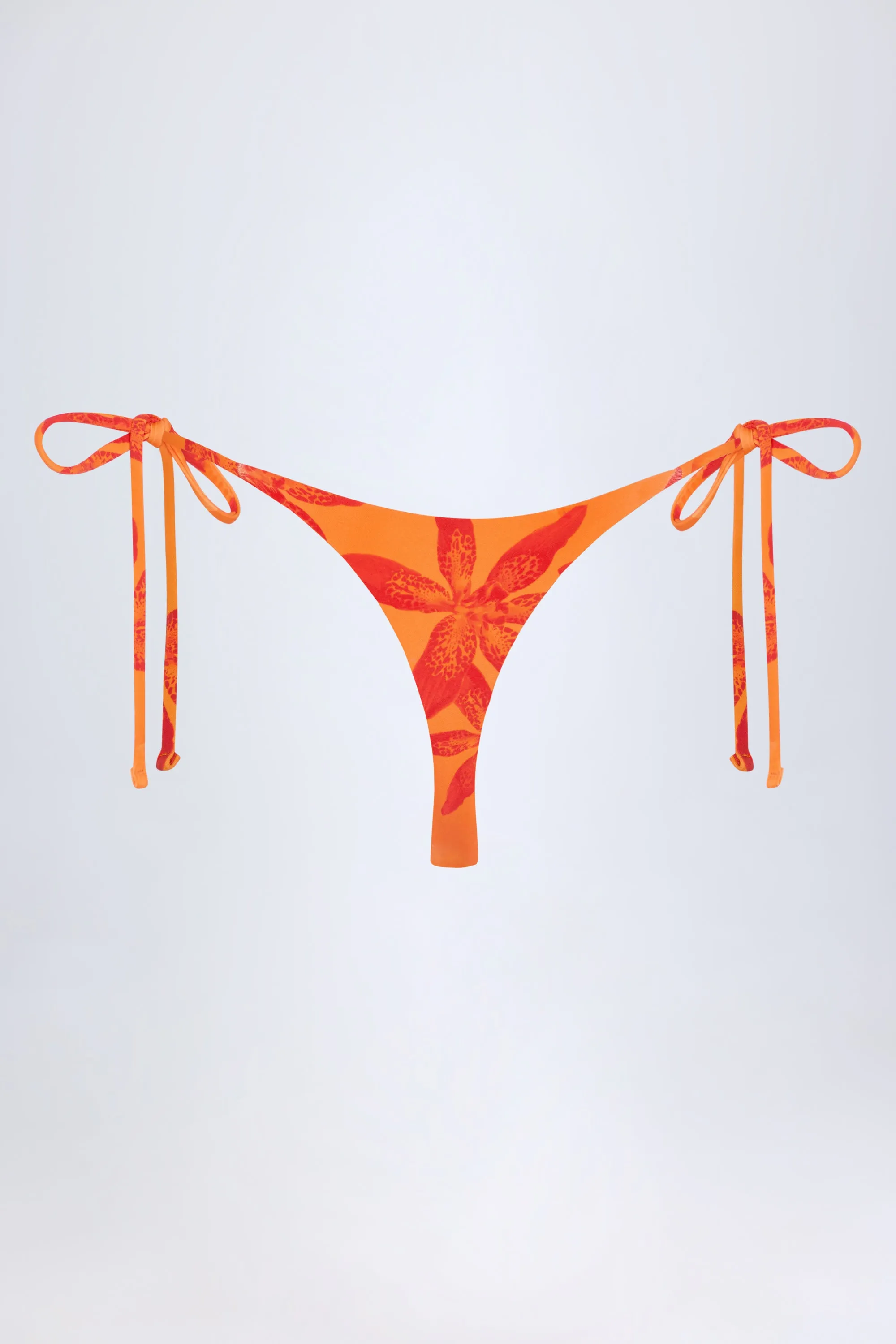 Side-Tie Thong Bikini Bottoms in Orange Orchid Print sold by Oh Polly product image thumbnail 4