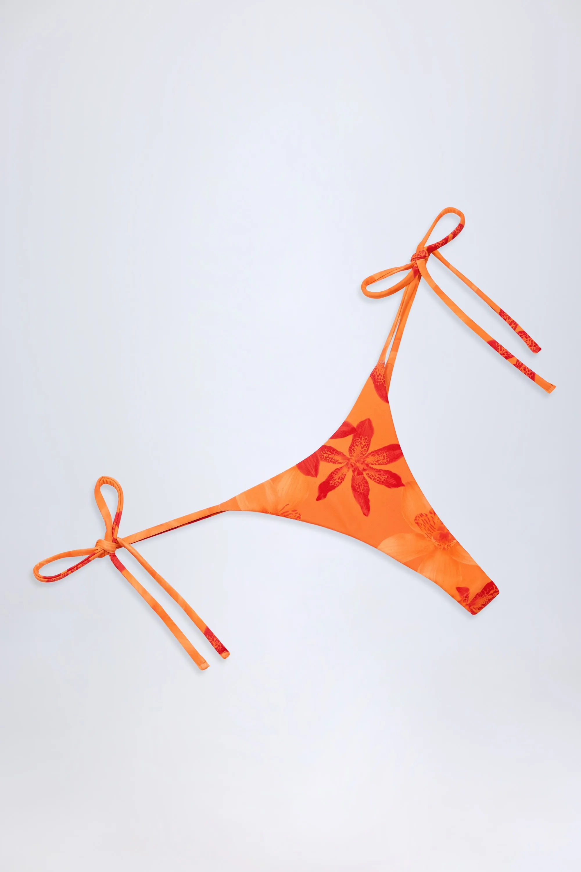 Side-Tie Thong Bikini Bottoms in Orange Orchid Print sold by Oh Polly product image thumbnail 5
