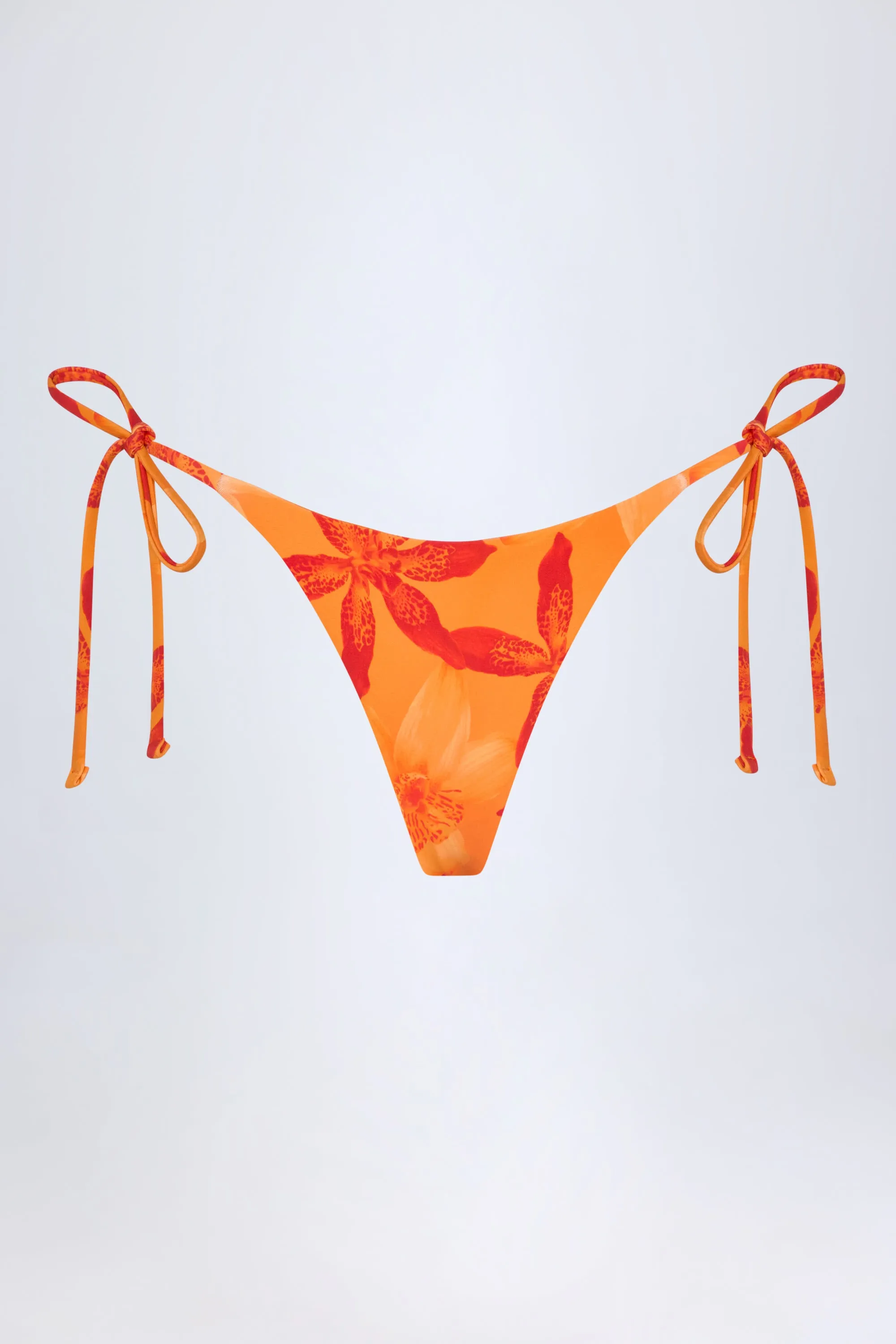 Side-Tie Thong Bikini Bottoms in Orange Orchid Print sold by Oh Polly product image thumbnail 3