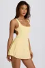 Soft Active Open-Back Pleated Tennis Dress in Lemon sold by Oh Polly