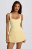 Soft Active Open-Back Pleated Tennis Dress in Lemon sold by Oh Polly