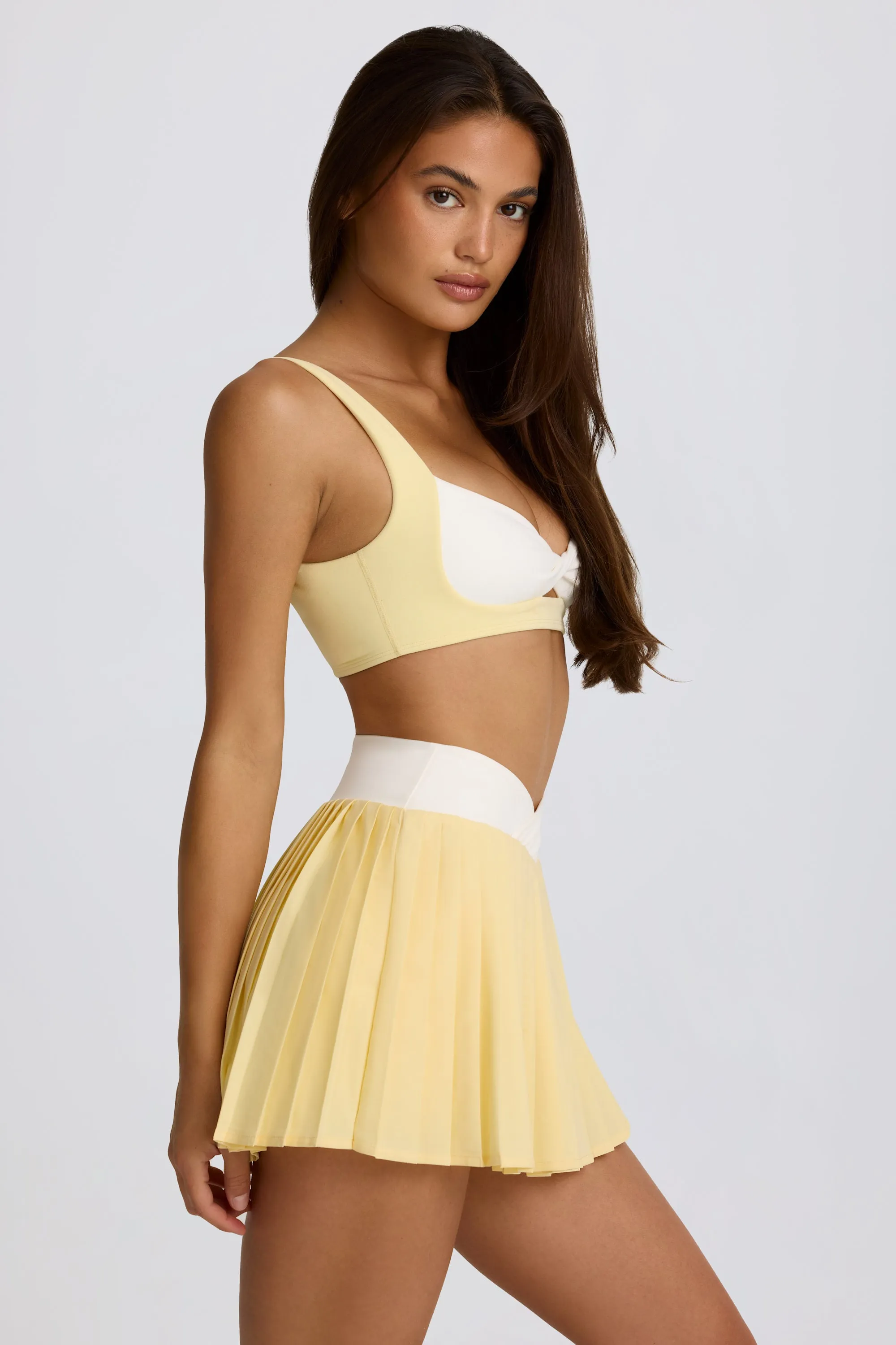 Soft Active Crossover Pleated Mini Skort in Lemon sold by Oh Polly product image thumbnail 3