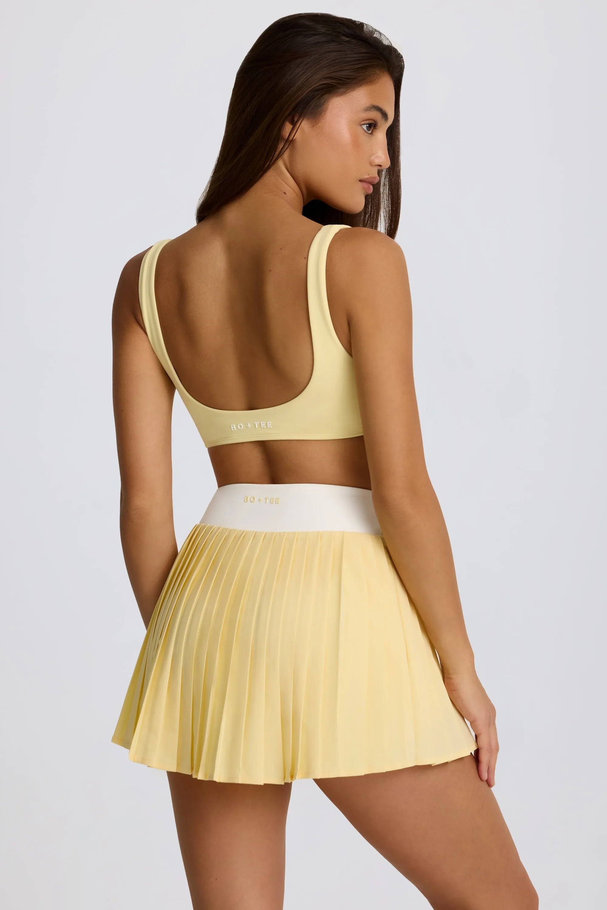 Soft Active Crossover Pleated Mini Skort in Lemon sold by Oh Polly product image thumbnail 2