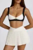 Soft Active Crossover Pleated Mini Skort in Ivory sold by Oh Polly
