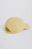 Baseball Cap in Lemon sold by Oh Polly