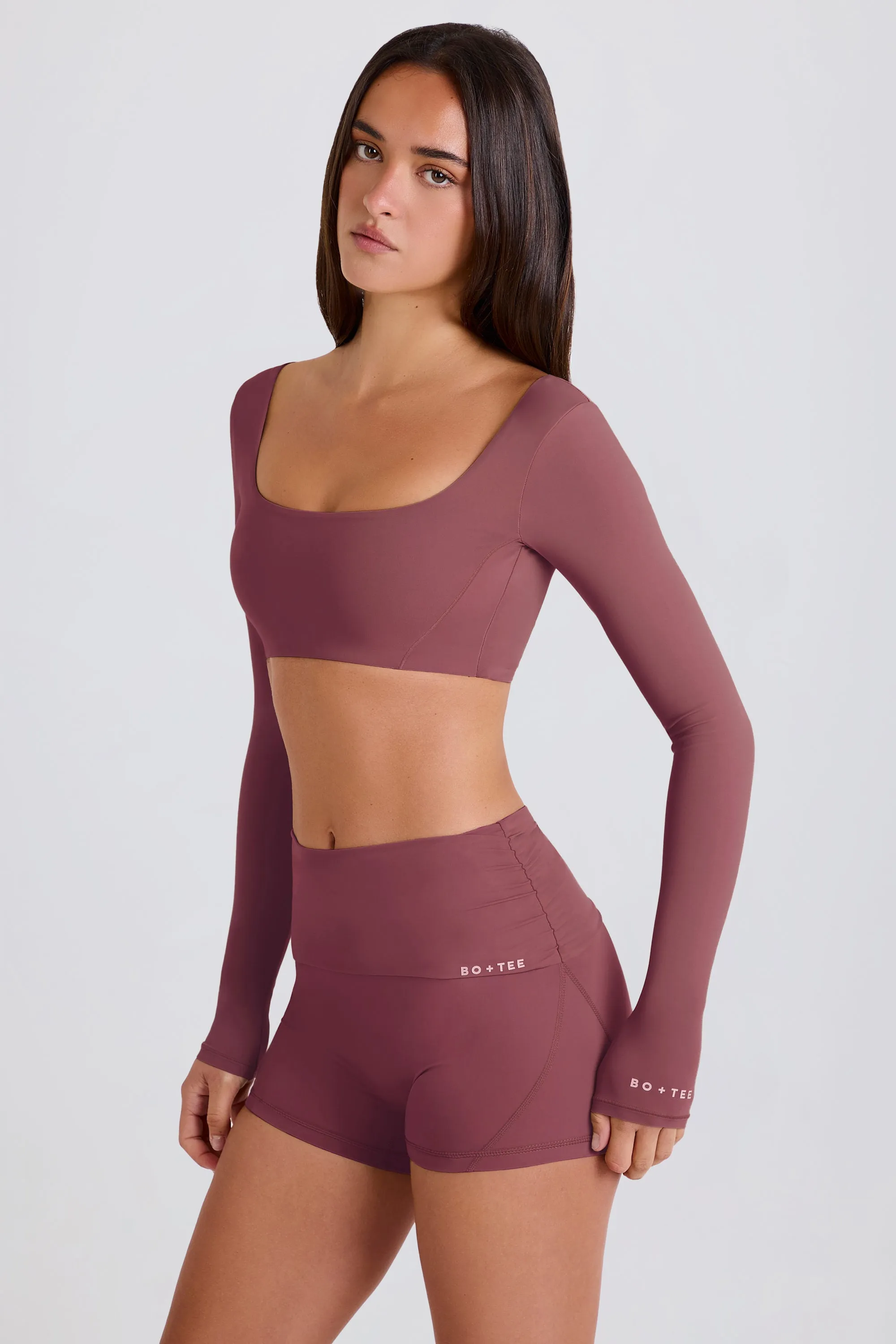Four-Way Stretch Foldover Mid-Rise Mini Shorts in Acai sold by Oh Polly product image thumbnail 2