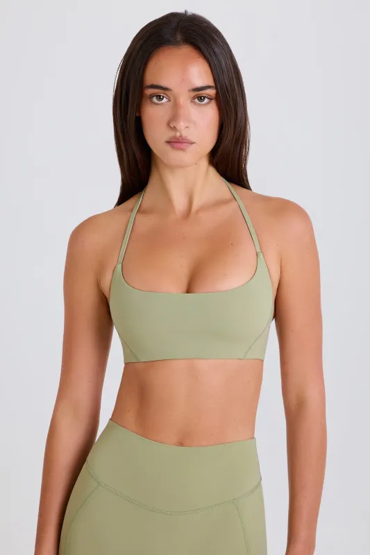 Scoop-Neck Halterneck Sports Bra in Matcha sold by Oh Polly