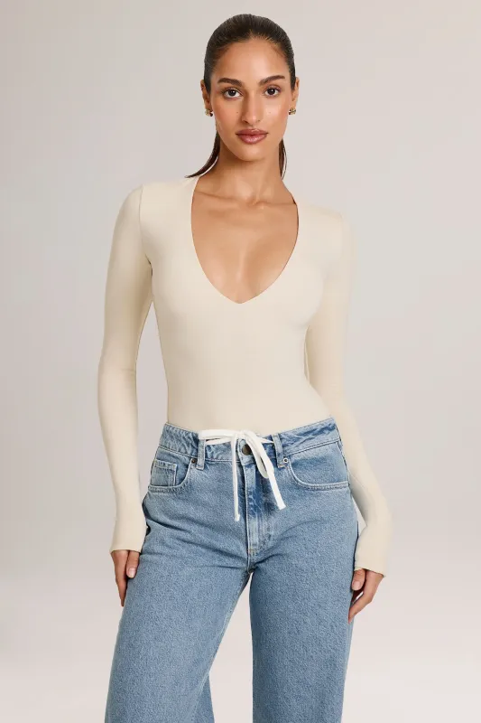 Modal Plunge Long-Sleeve Bodysuit  in Ivory sold by Oh Polly