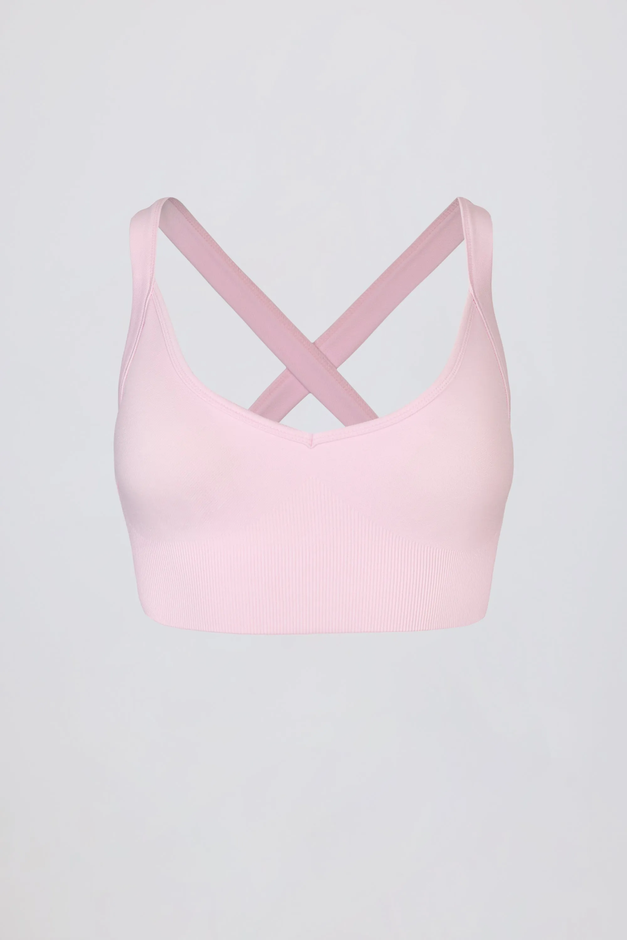 Super Sculpt Seamless Crossback Sports Bra in Powder Pink sold by Oh Polly