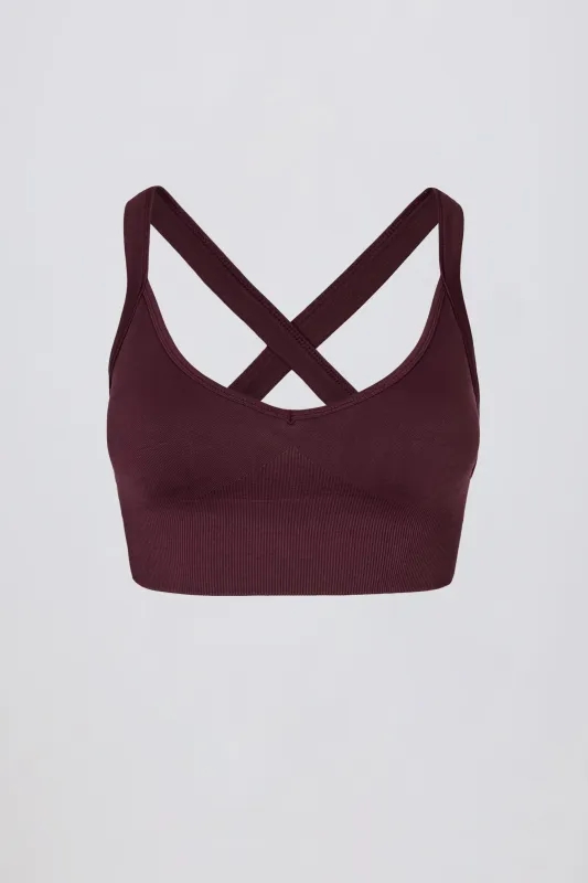 Super Sculpt Seamless Cross-Back Sports Bra in Burgundy sold by Oh Polly