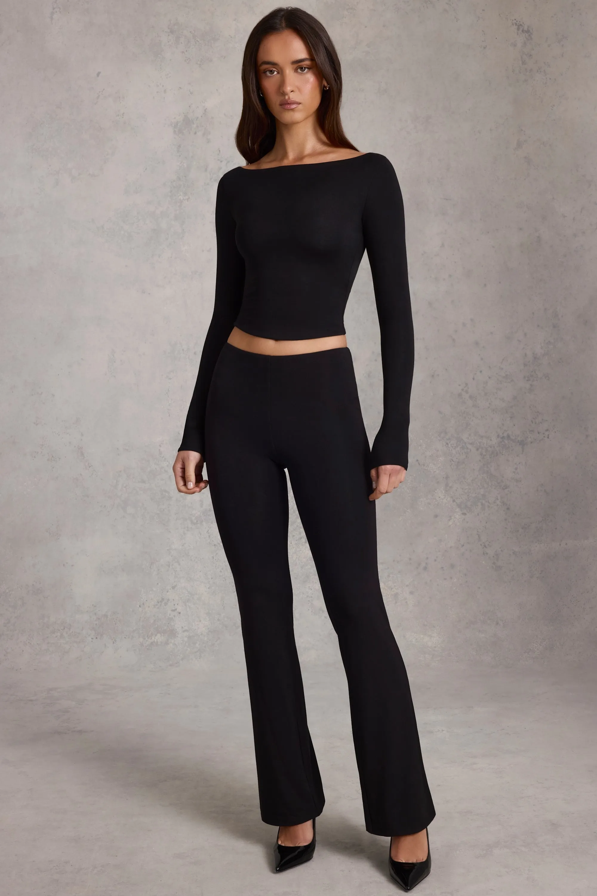 Modal Mid-Rise Flared Trousers in Black sold by Oh Polly