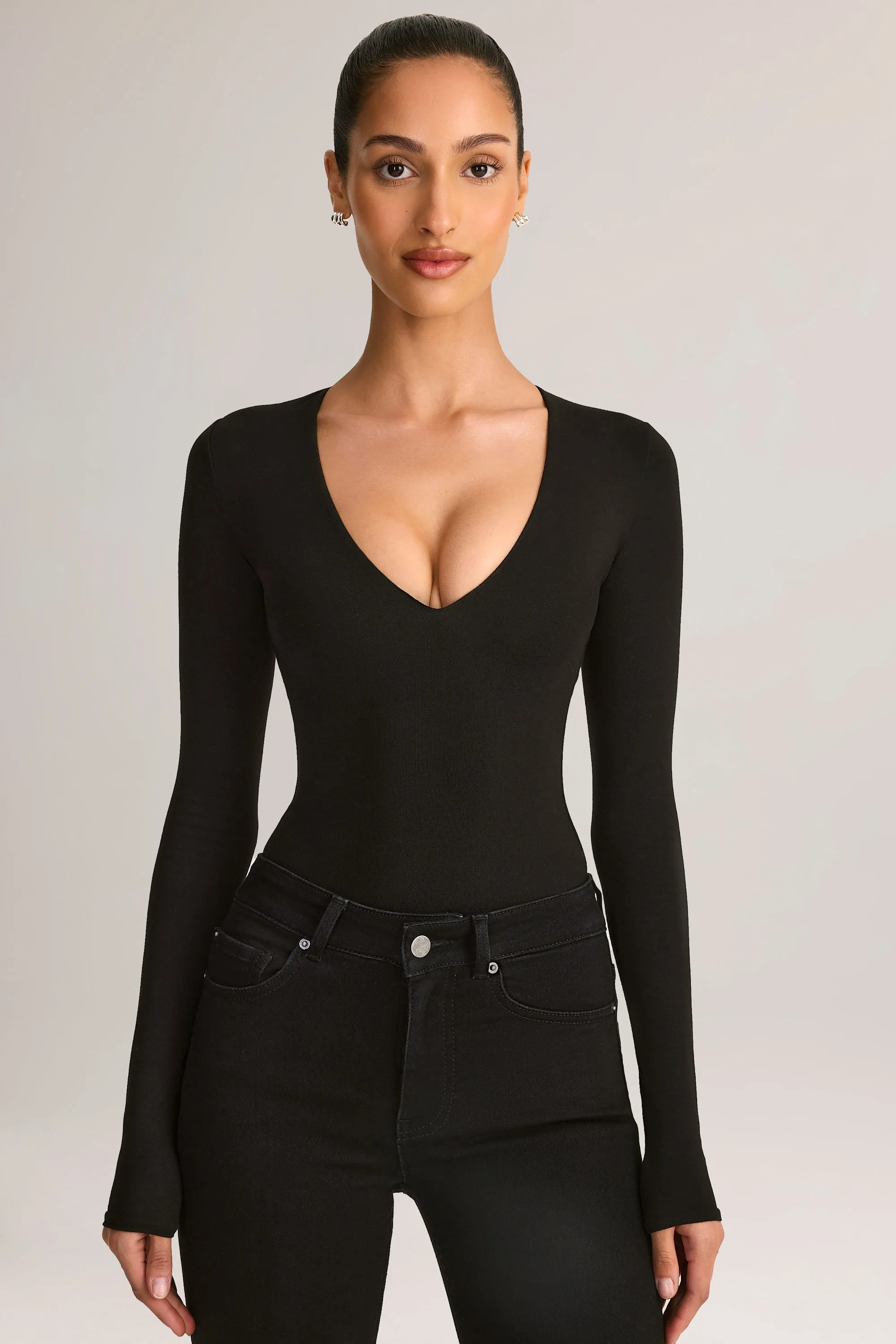 Modal Plunge Long-Sleeve Bodysuit in Black sold by Oh Polly