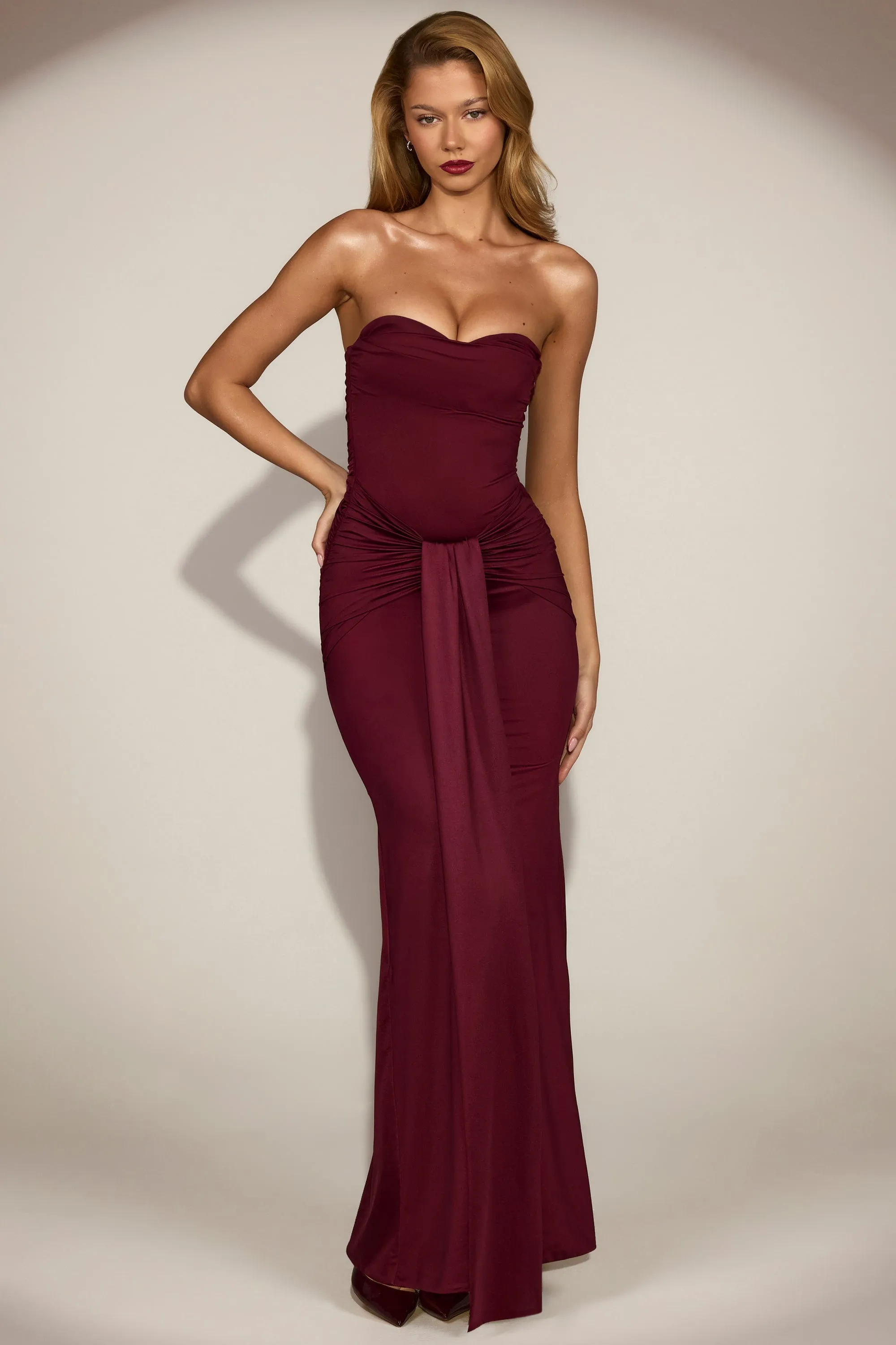 Satin Peekaboo Bandeau Draped Gown in Wine Red sold by Oh Polly