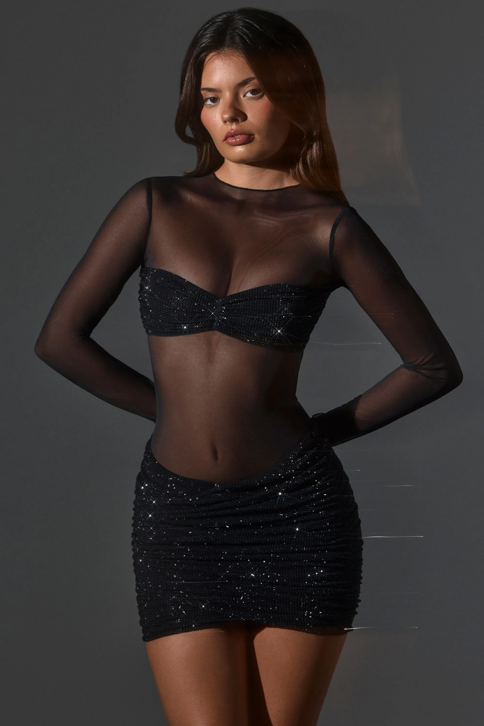 Sheer Embellished High-Neck Long Sleeve Mini Dress in Black sold by Oh Polly