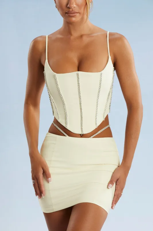Embellished Cut Out Mini Skirt in Ivory sold by Oh Polly
