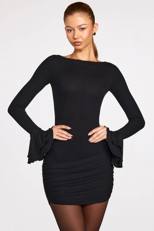 Ribbed Modal Long-Sleeve Draped Mini Dress in Black sold by Oh Polly
