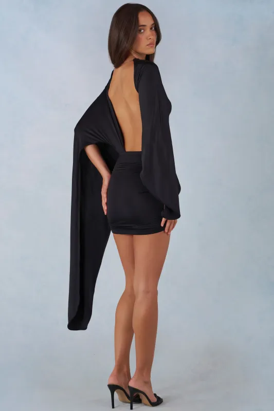 Draped Cape Mini Dress in Black sold by Oh Polly