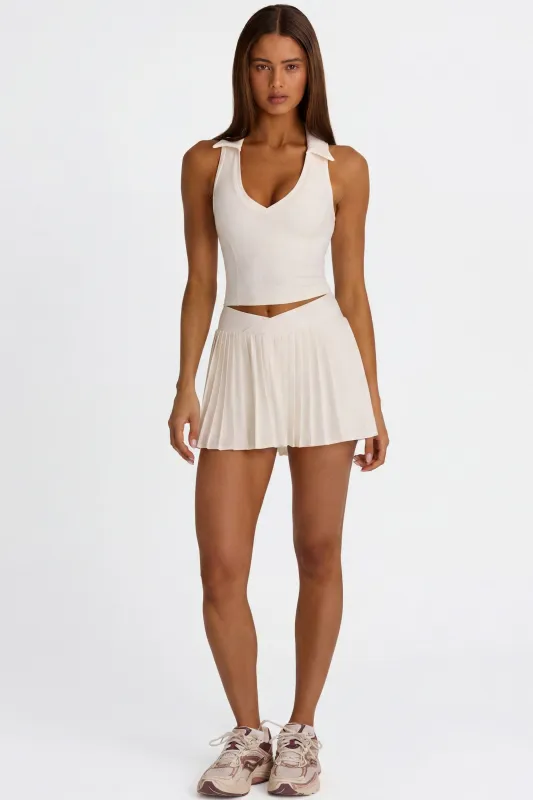 Soft Active Crossover Pleated Mini Skort in Coconut made by Bo + Tee