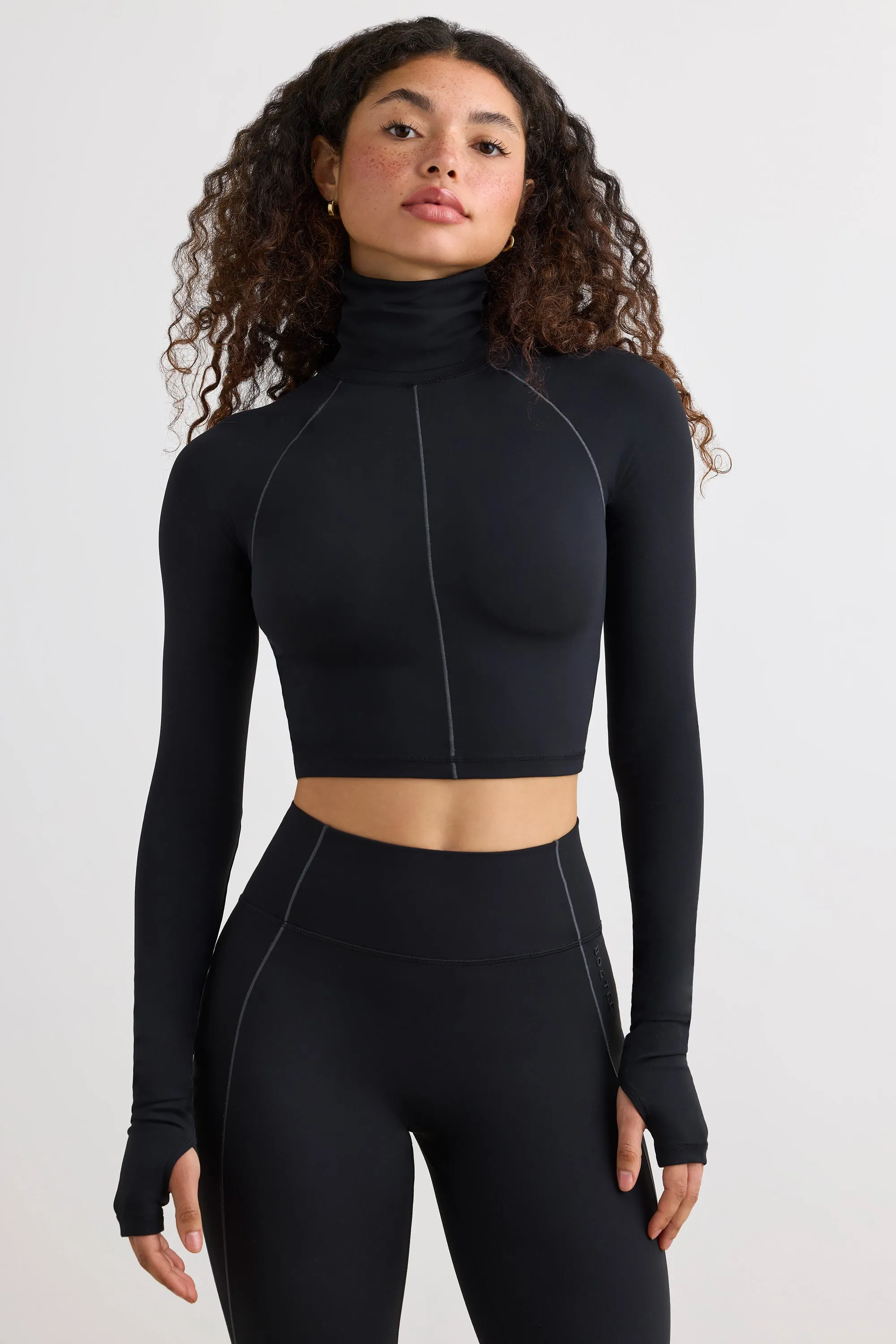 Soft Active Turtleneck Crop Top in Black sold by Oh Polly