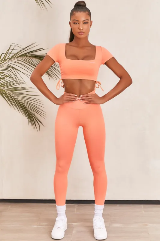 Potential Petite Slinky Full Length Leggings in Orange sold by Oh Polly