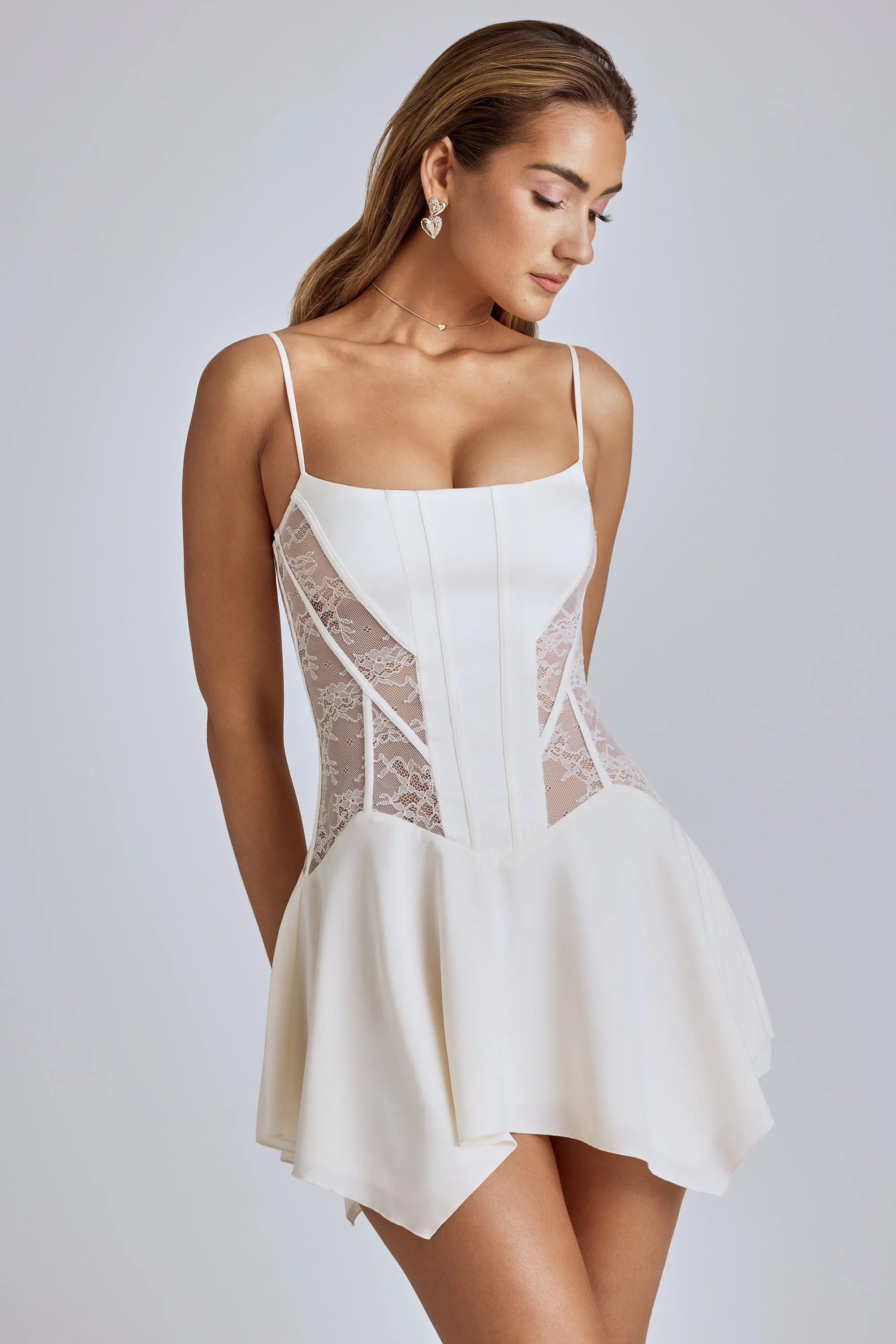 Lace Handkerchief Hem Mini Dress in Ivory sold by Oh Polly