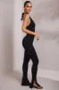 Petite Halter Neck Plunge Jumpsuit in Black sold by Oh Polly