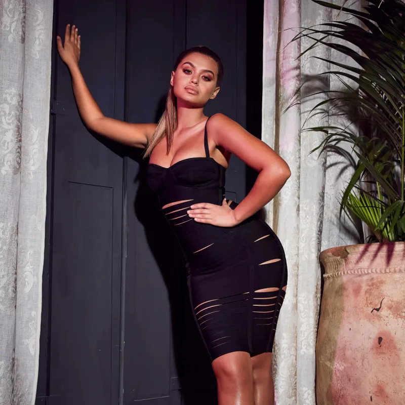 Read Between The Lines Cut Out Bandage Midi Dress in Black made by Oh Polly