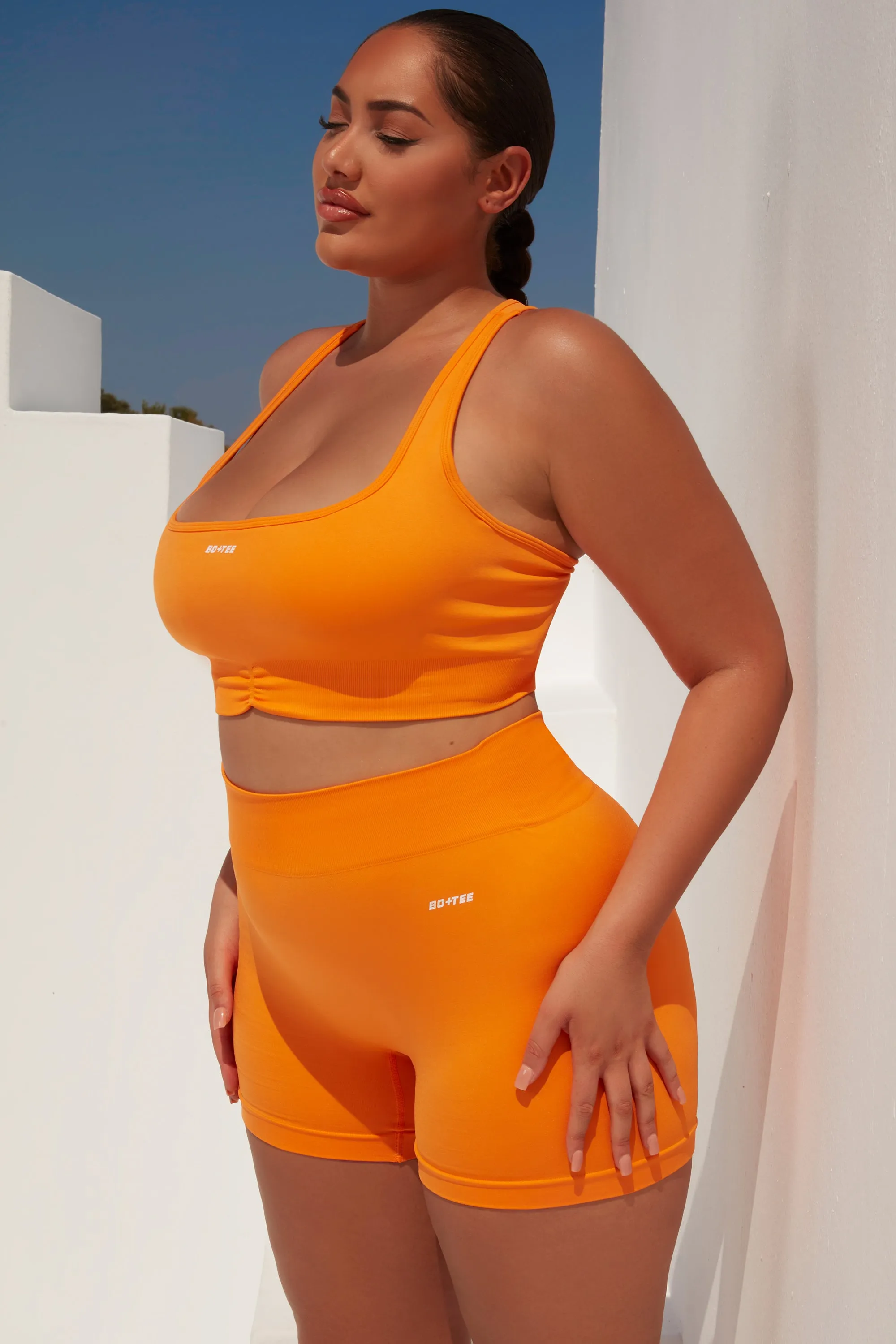 Radiate Ruched Sports Bra in Orange sold by Oh Polly product image thumbnail 3