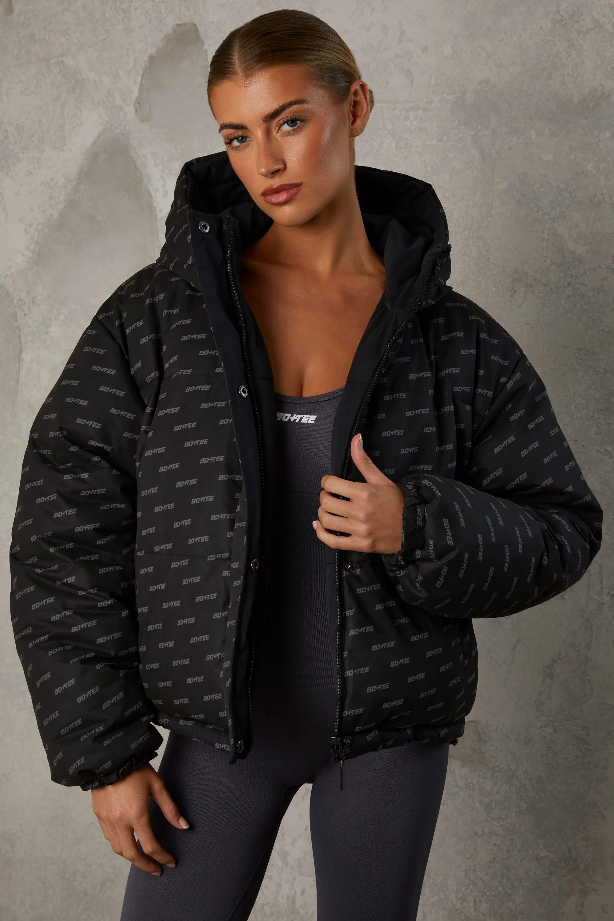 Reversible Hooded Puffer Jacket in Black sold by Oh Polly