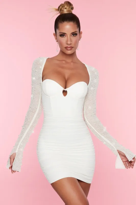 Embellished Long-Sleeve Mini Dress in White sold by Oh Polly