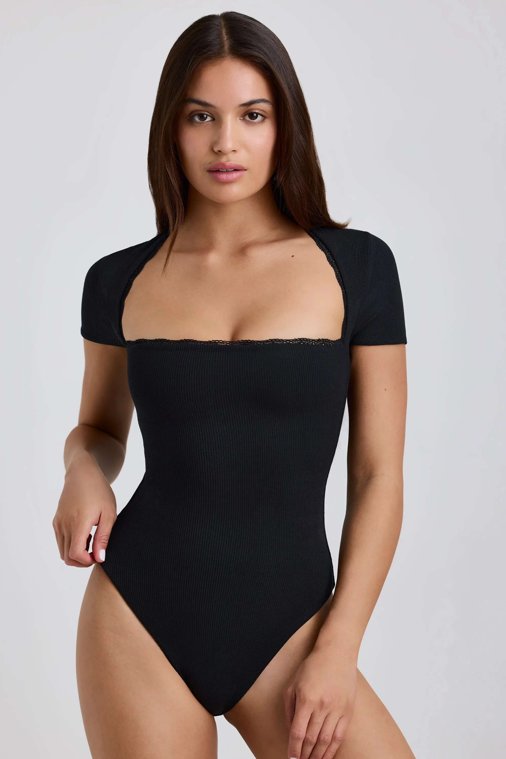 Ribbed Modal Lace-Trim Bodysuit in Black sold by Oh Polly
