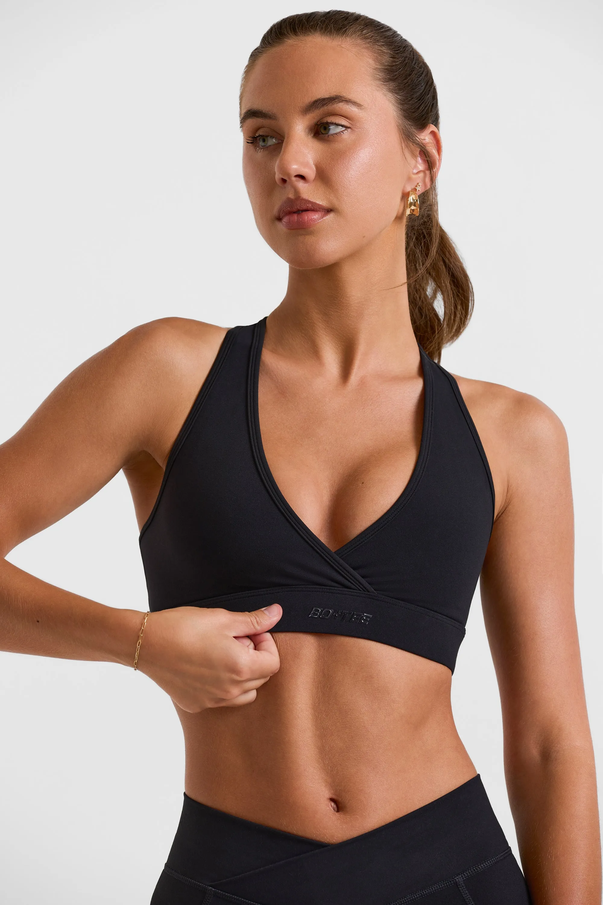 Cut Out Back Sports Bra in Black sold by Oh Polly