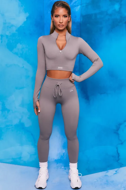 Endure Ribbed Long Sleeve Half Zip Crop Top in Dark Grey sold by Oh Polly