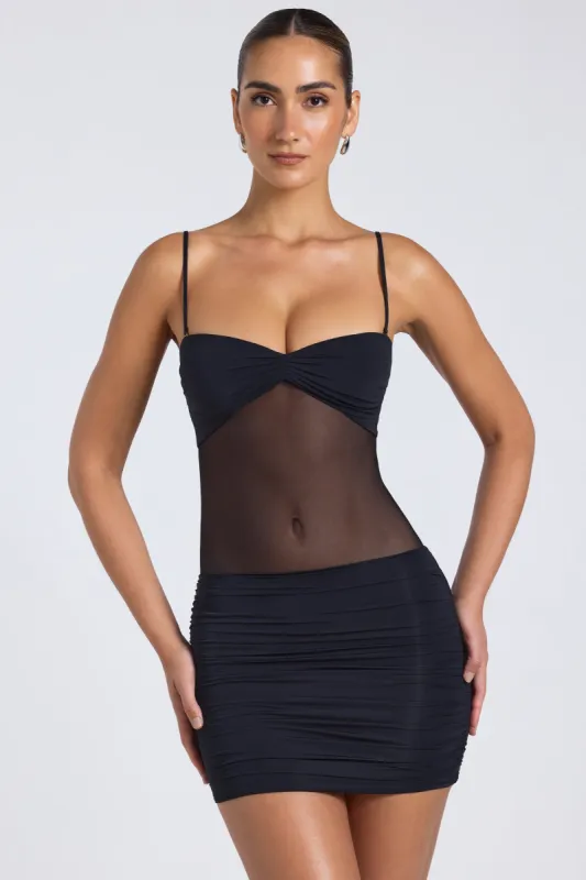 Sheer Panelled Ruched Mini Dress in Black sold by Oh Polly
