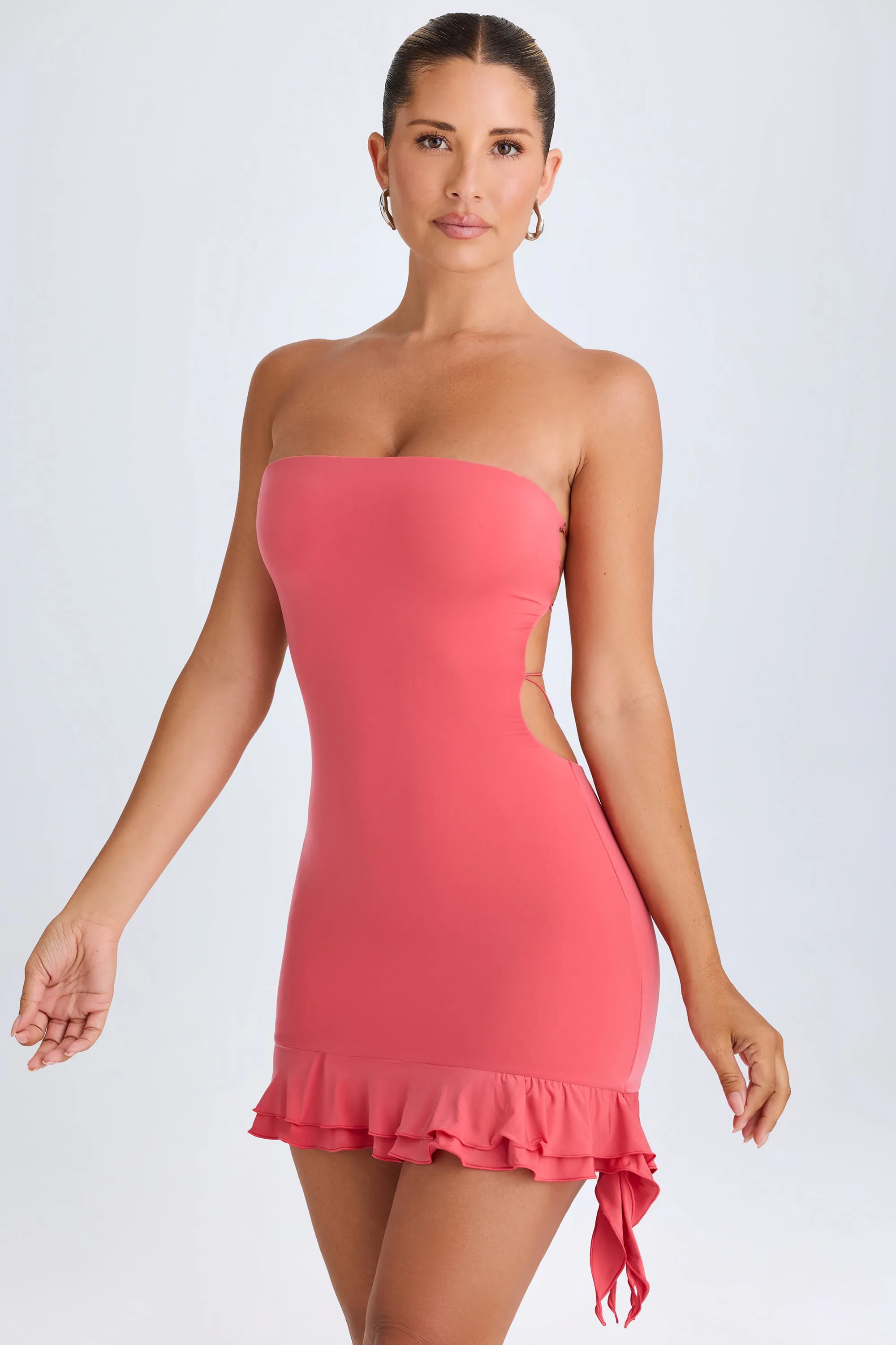 Ruffle-Trim Cut-Out Bandeau Mini Dress in Coral sold by Oh Polly