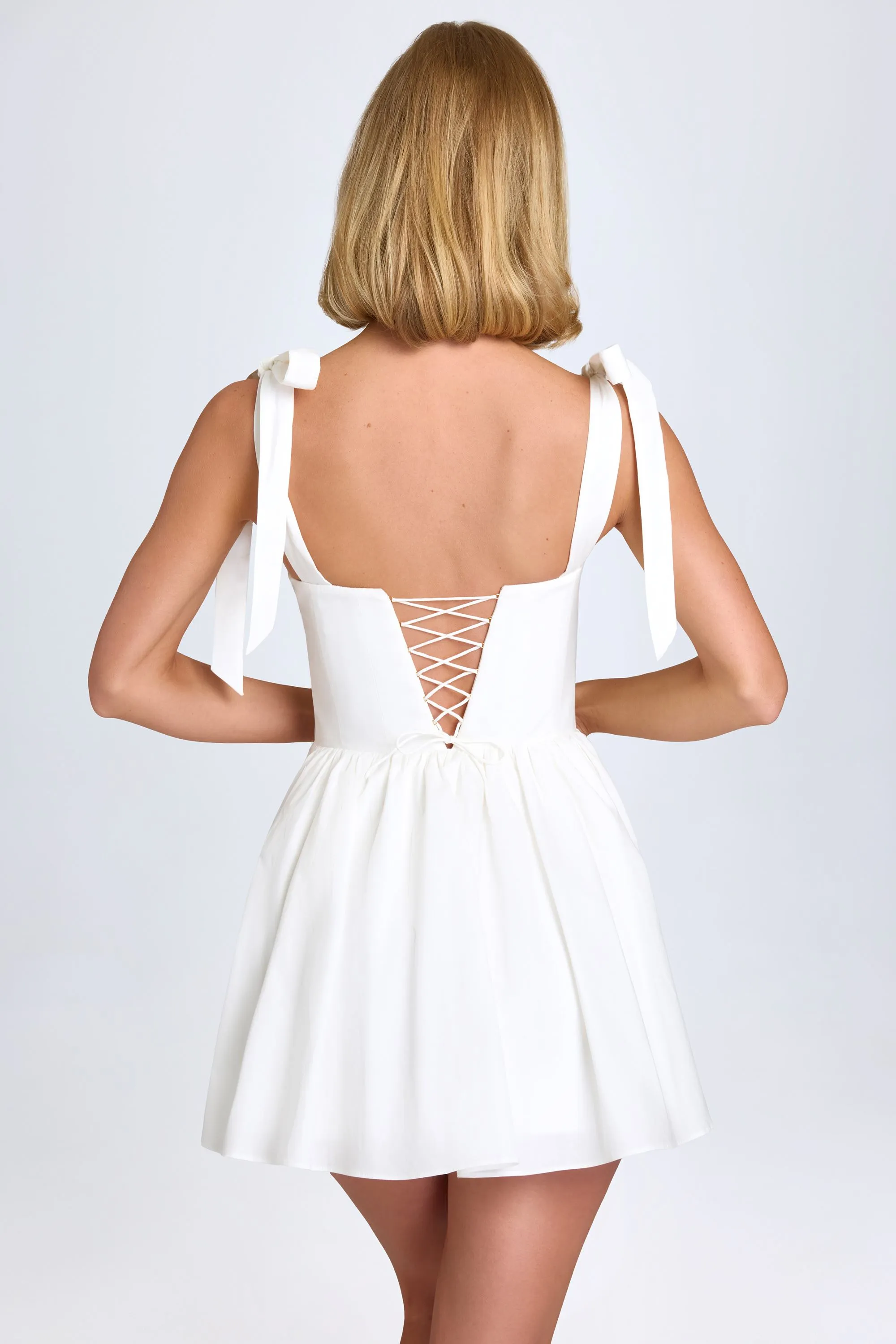 Ruched Corset Mini Dress in White sold by Oh Polly product image thumbnail 4