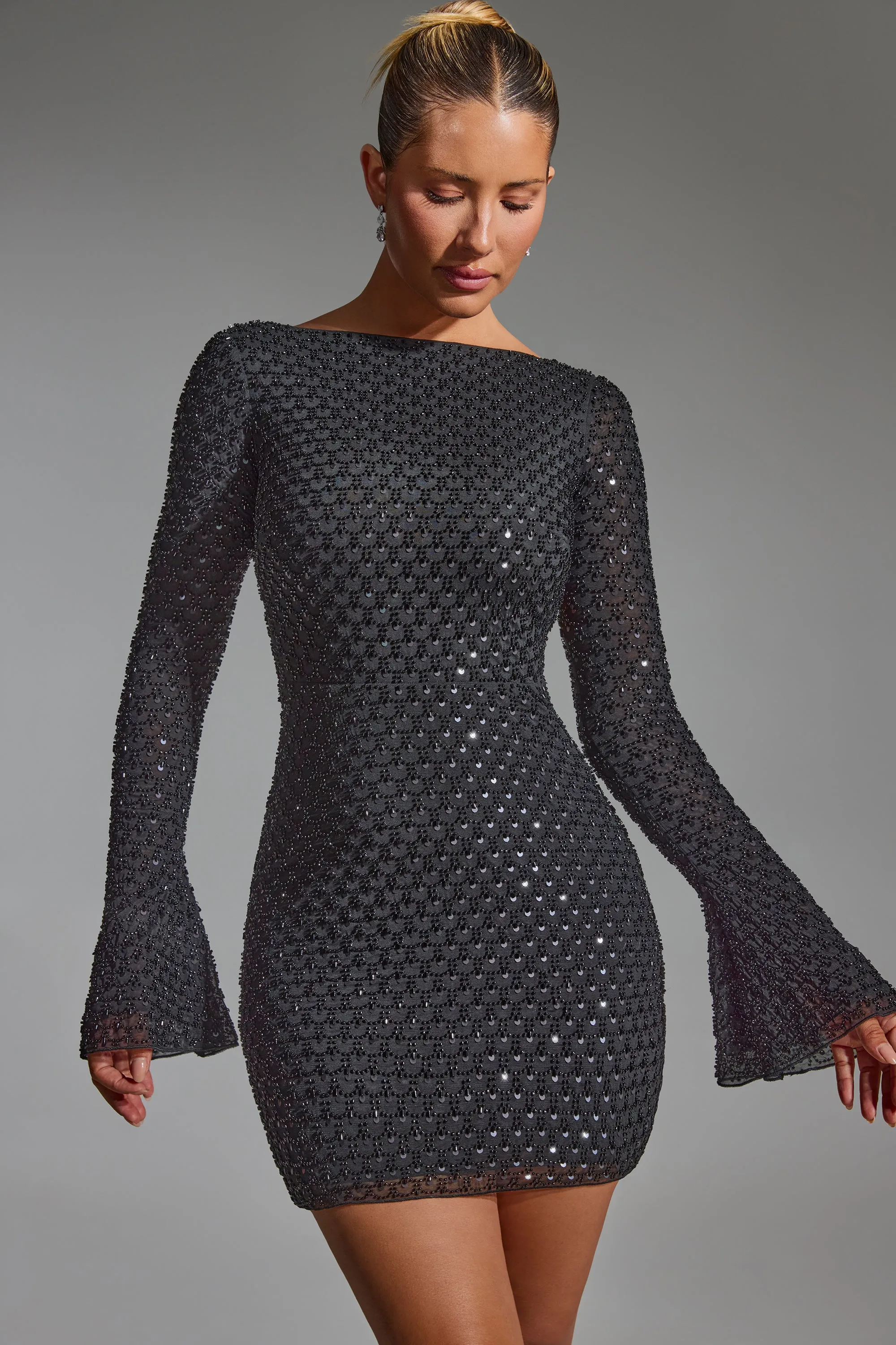 Embellished Open-Back A-Line Mini Dress in Black sold by Oh Polly