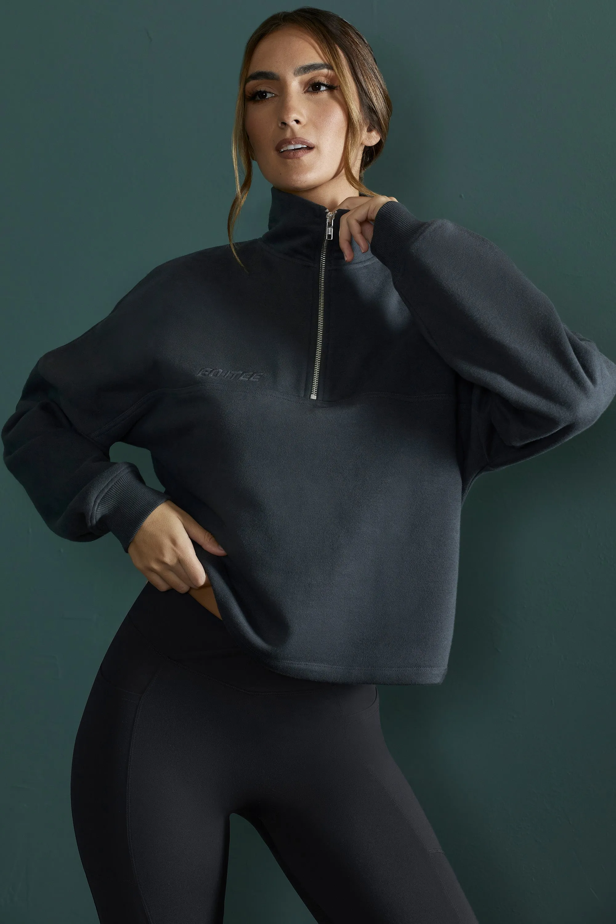 Oversized Half Zip Sweatshirt in Black sold by Oh Polly